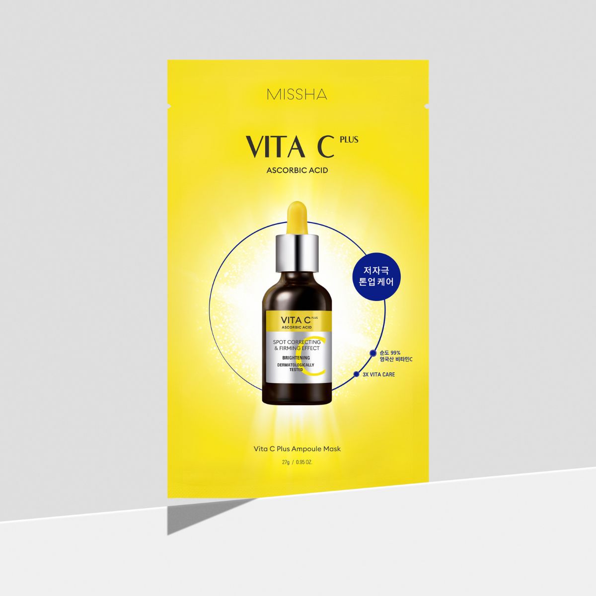 Missha Vita C Plus Ampoule Mask sheet laid flat, showcasing the bright orange packaging and the mask sheet inside.