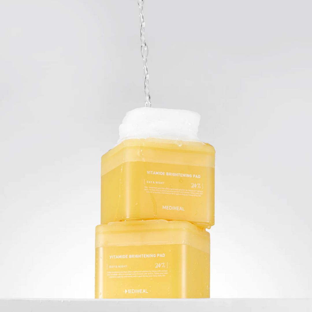 Mediheal Vitamide Brightening Pad toner pad, 100-piece pack, designed for skin brightening and exfoliation.