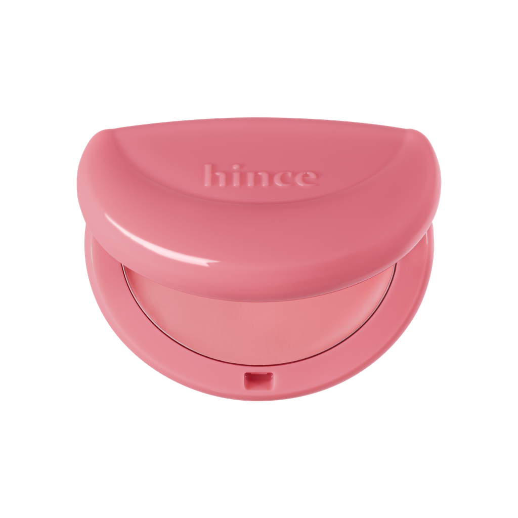 Hince Half-Moon Cheek Cream to Powder Blush in a compact with a soft pink shade and a half-moon design on the surface.