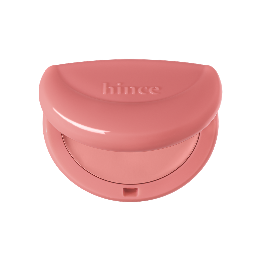 Hince Half-Moon Cheek Cream to Powder Blush in a compact with a soft pink shade and smooth, blendable texture.