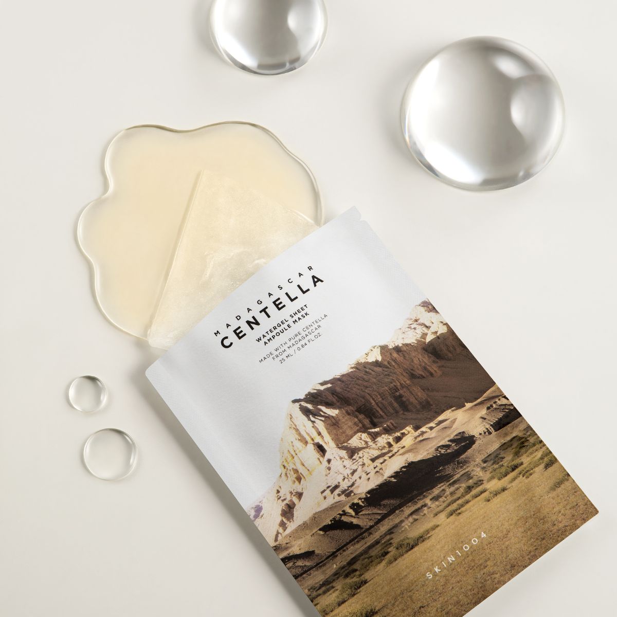 SKIN1004 Madagascar Centella Watergel Sheet Mask showing a single sheet mask soaked in gel for soothing skincare.