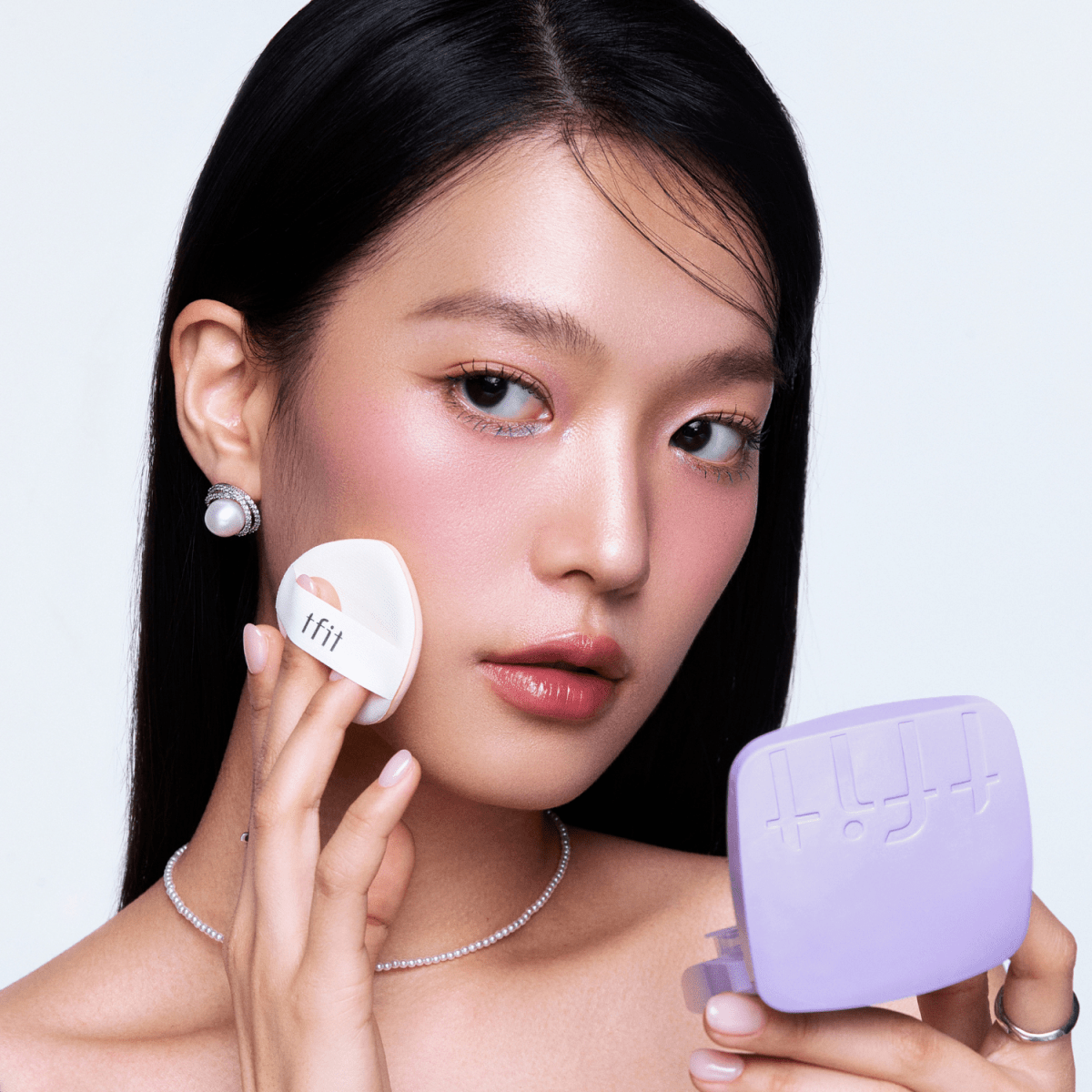 TFIT Base Fit Tone Up Sun Cushion foundation in a compact with a mirror, featuring a light beige shade for natural skin tone enhancement.