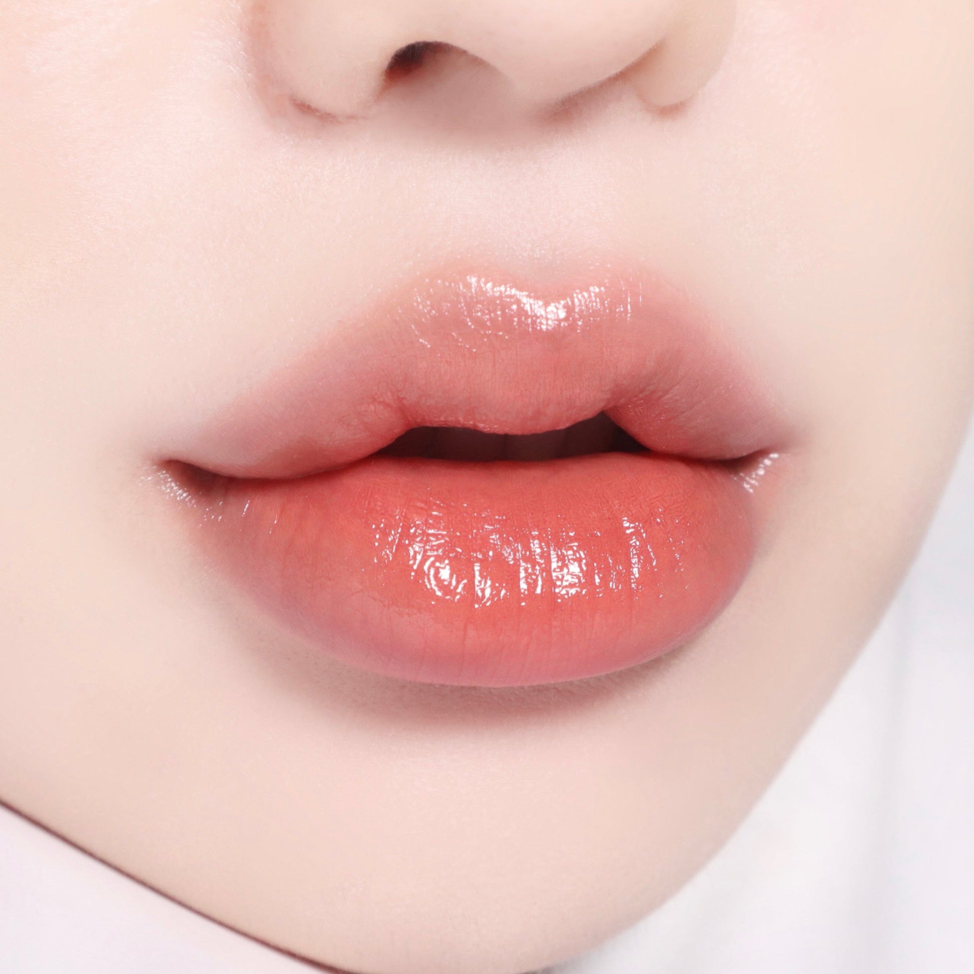 Banila Co B. By Banila Glow Veil Lipstick in cozy beige, showing a full lips with smooth, glossy finish