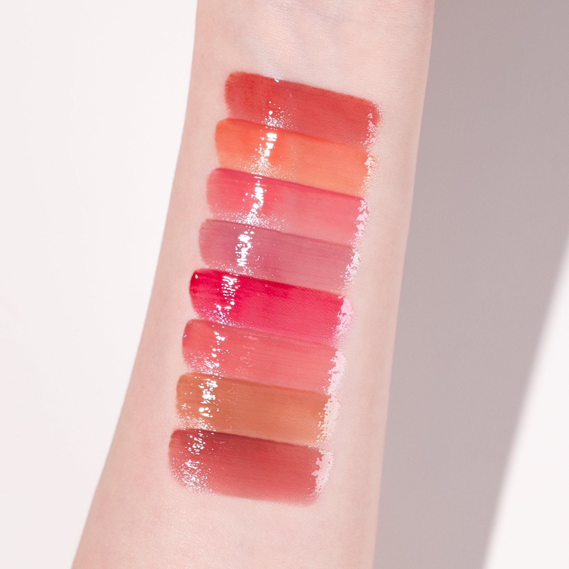 Clio Crystal Glam Lip Tint in a sleek tube with a glossy finish, ready for application on lips.