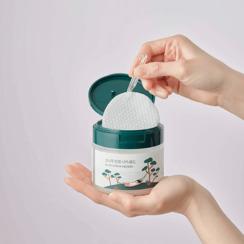 Round Lab Pine Calming Cica Pad toner pad with 50 pieces for soothing, calming skincare in a clear container.