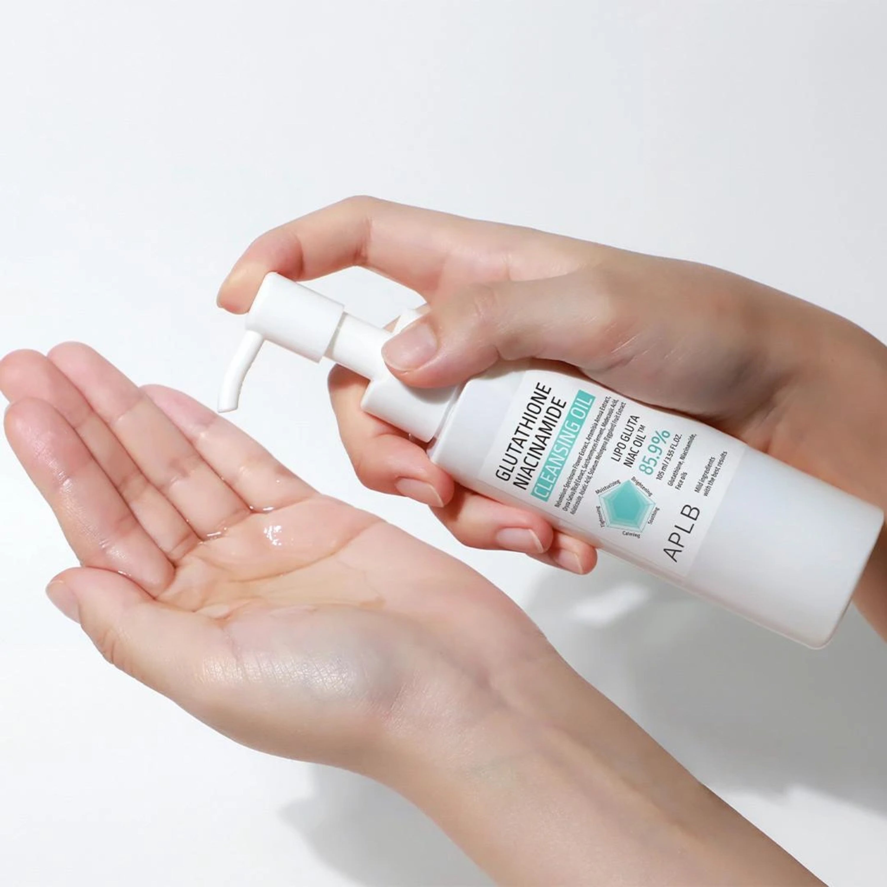 A bottle of APLB Glutathione Niacinamide Cleansing Oil 105ml, with a clear liquid inside and a minimalist label design.