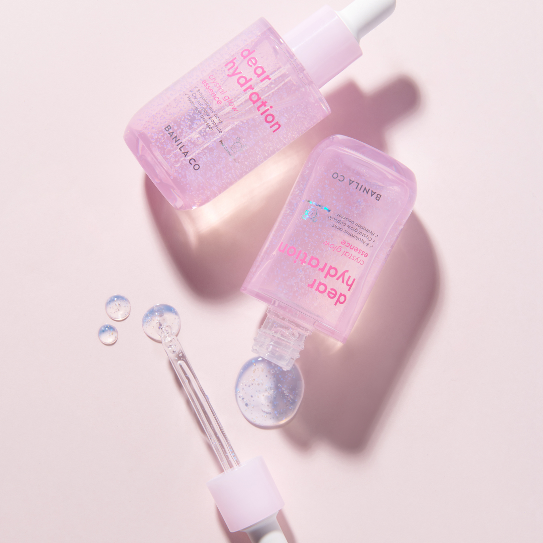 Banila Co Dear Hydration Crystal Glow Essence 50ml bottle with clear, luminous liquid inside, highlighting the skincare essence.