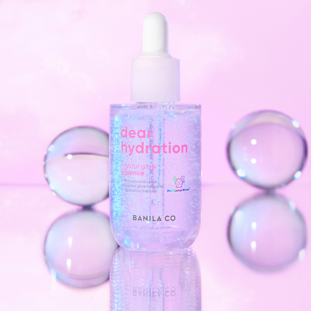 Banila Co Dear Hydration Crystal Glow Essence bottle with clear liquid and elegant packaging, 50ml size for skin hydration.