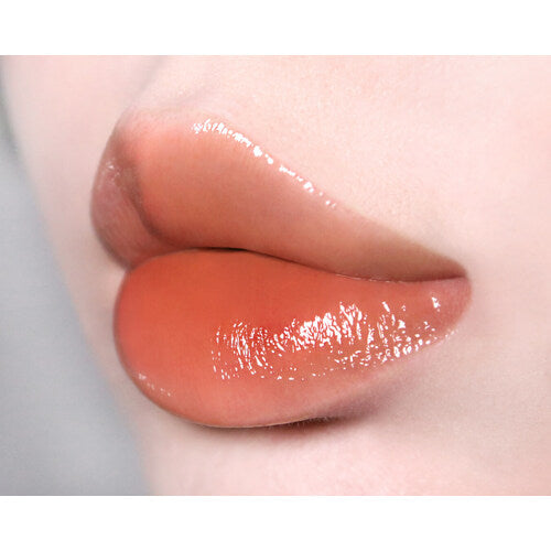 Too Cool For School Artclass Clair Tint lip tint in sleek tube, showing the vibrant color and glossy finish on a white background.