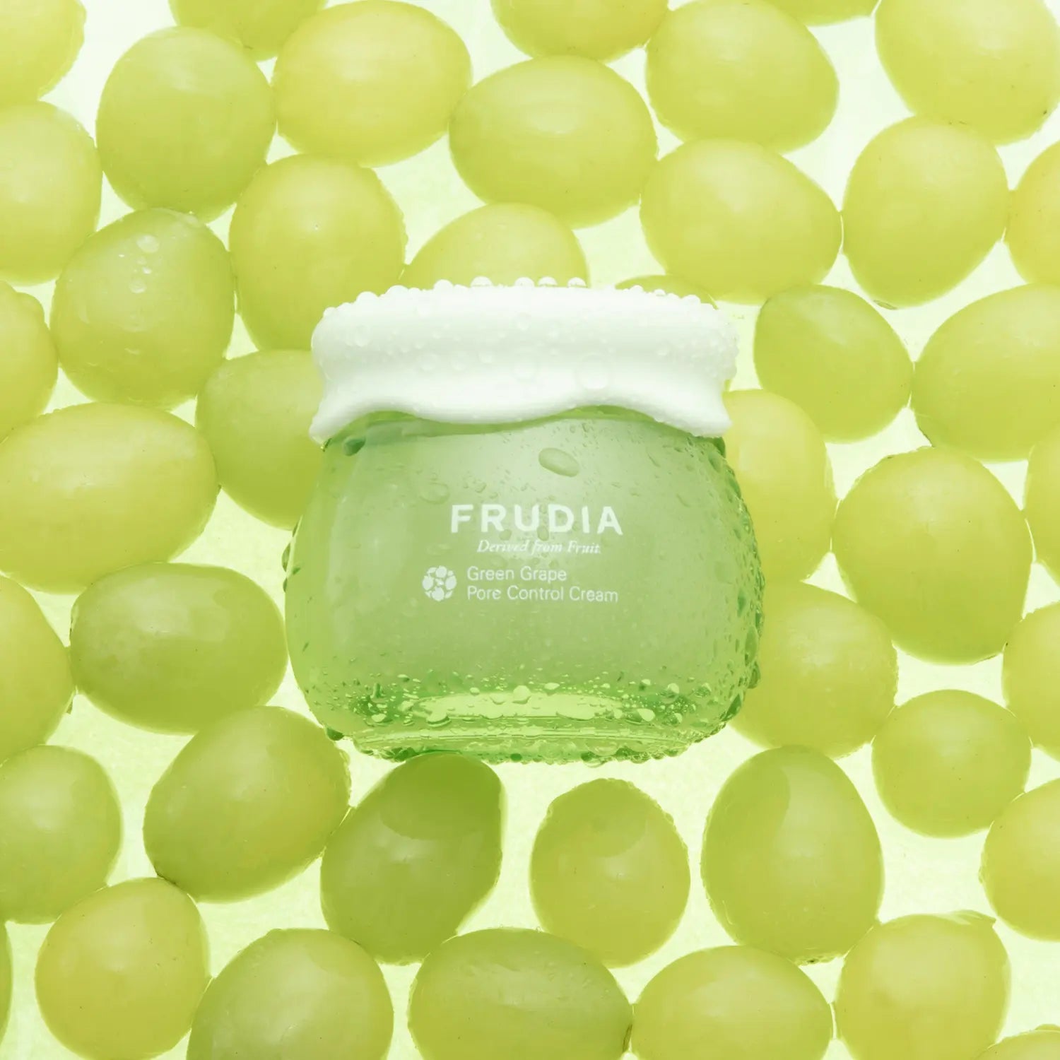 Frudia Green Grape Pore Control Cream, a face moisturizer with a light green cream texture and fresh grape scent.