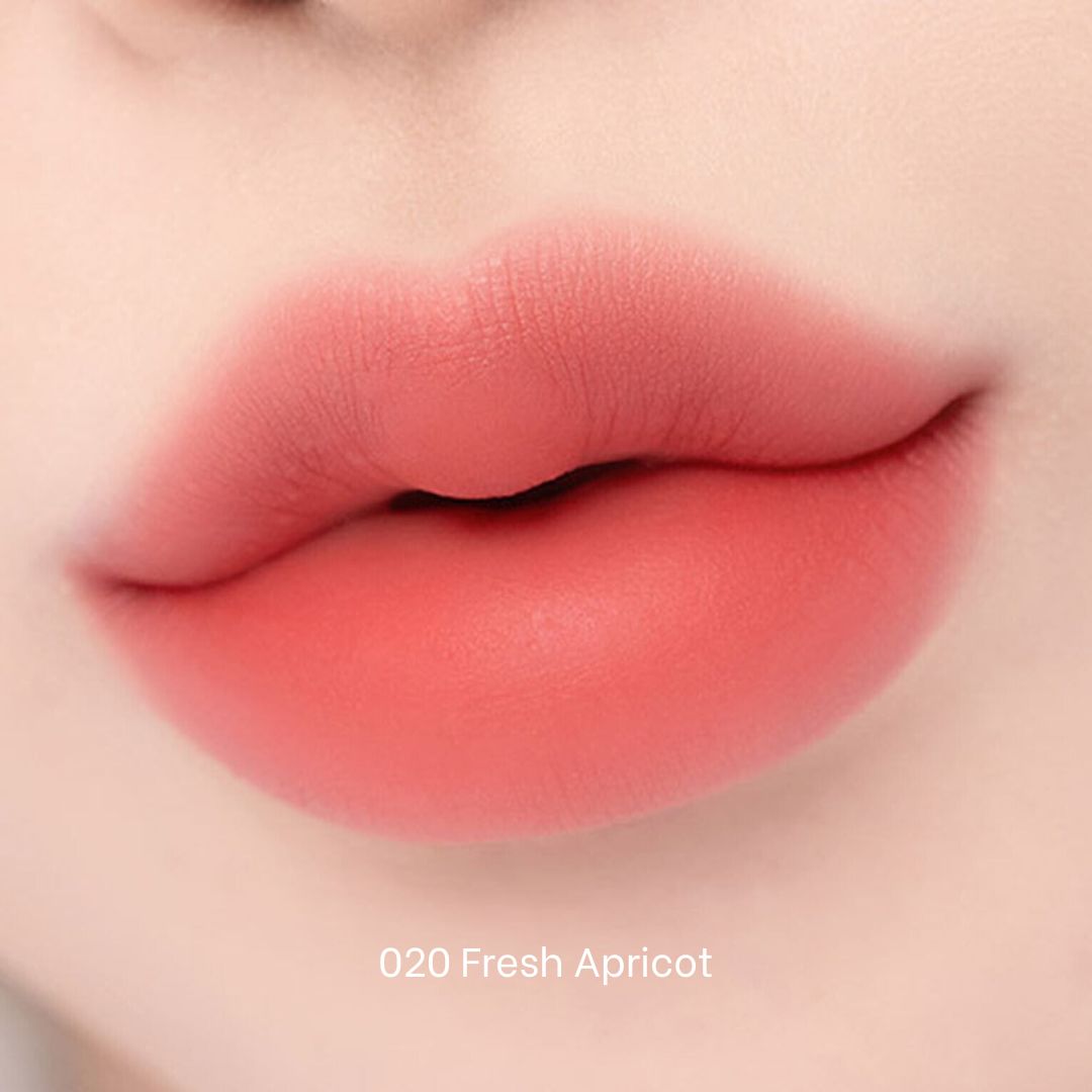 Clio Chiffon Blur Tint lip tint in fresh apricot shade, featuring a smooth, semi-matte finish on the lips.