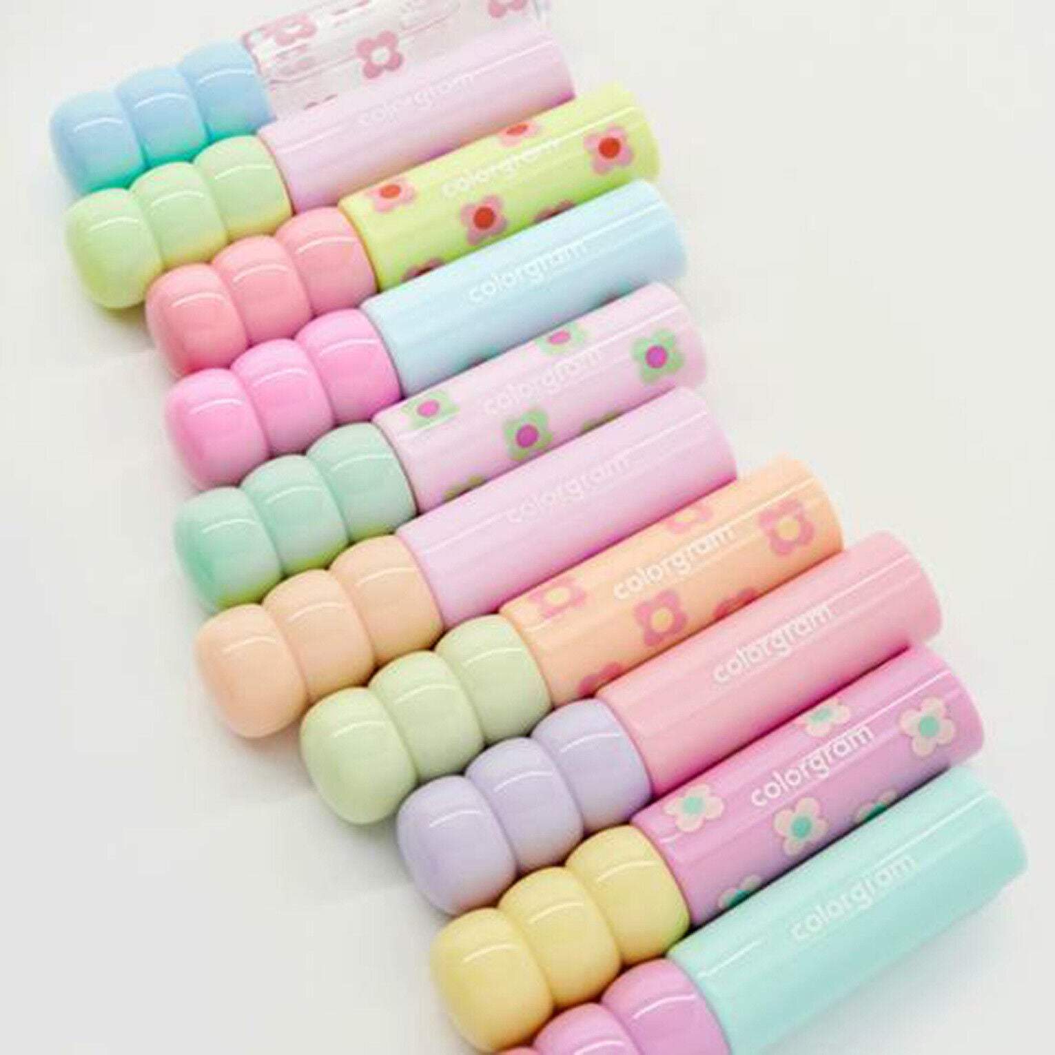 Colorgram Fruity Glass Tint Lip Tint in a vibrant array of 10 colorful shades, displayed in a close-up shot.