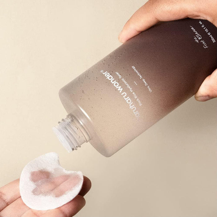 Haruharu Wonder Black Rice Hyaluronic Toner in 300ml bottle, shown with textured liquid inside, suitable for hydrating skin.
