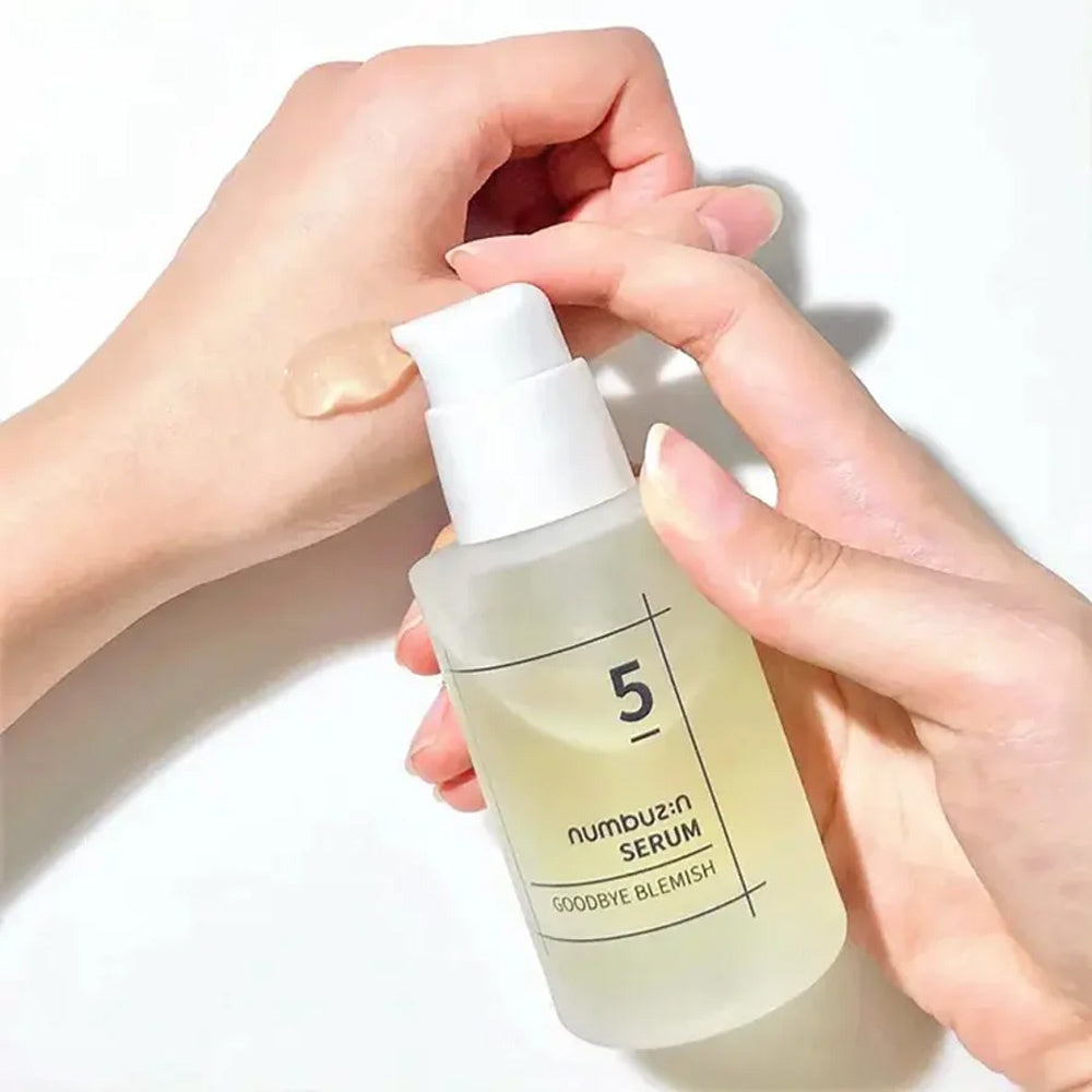 Numbuzin No.5 Goodbye Blemish Serum 50ml bottle, clear glass container with dropper, on a neutral background.