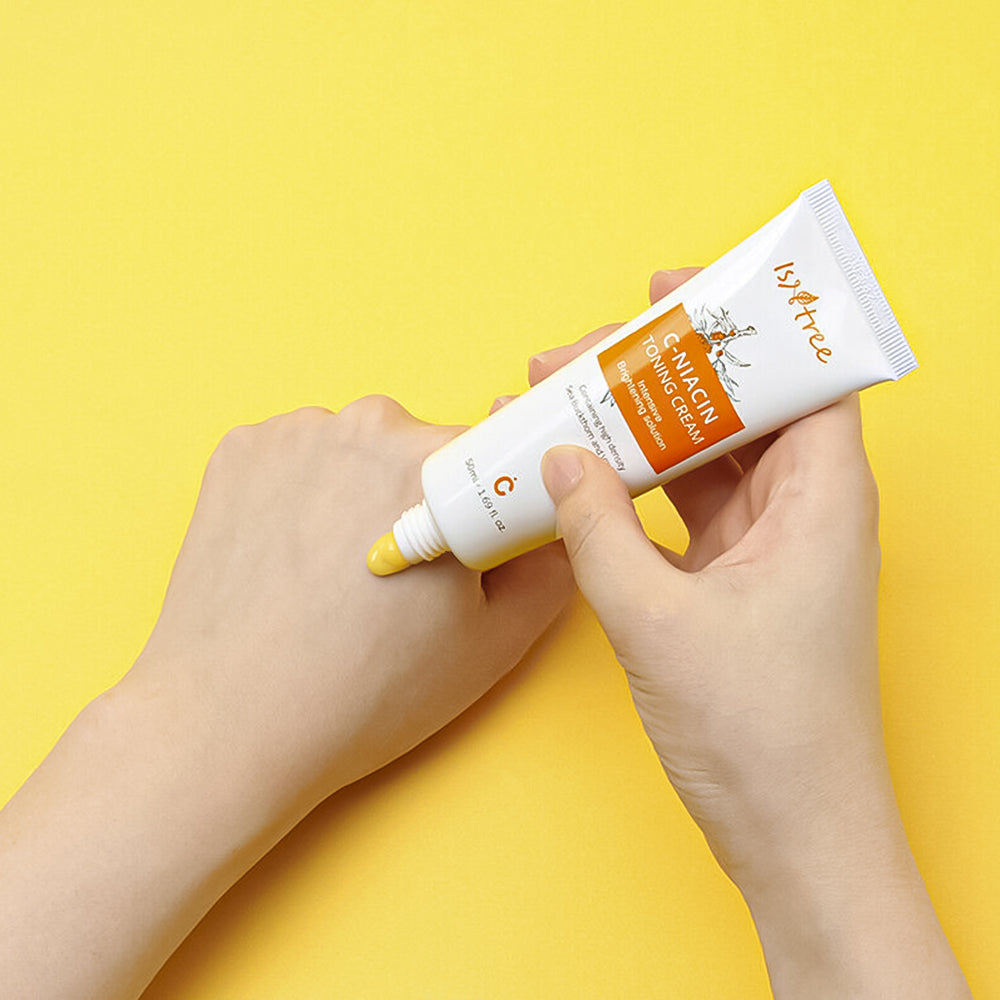 Isntree C-Niacin Toning Cream 50ml face moisturizer with brightening and toning properties, shown in a white jar with a blue cap.