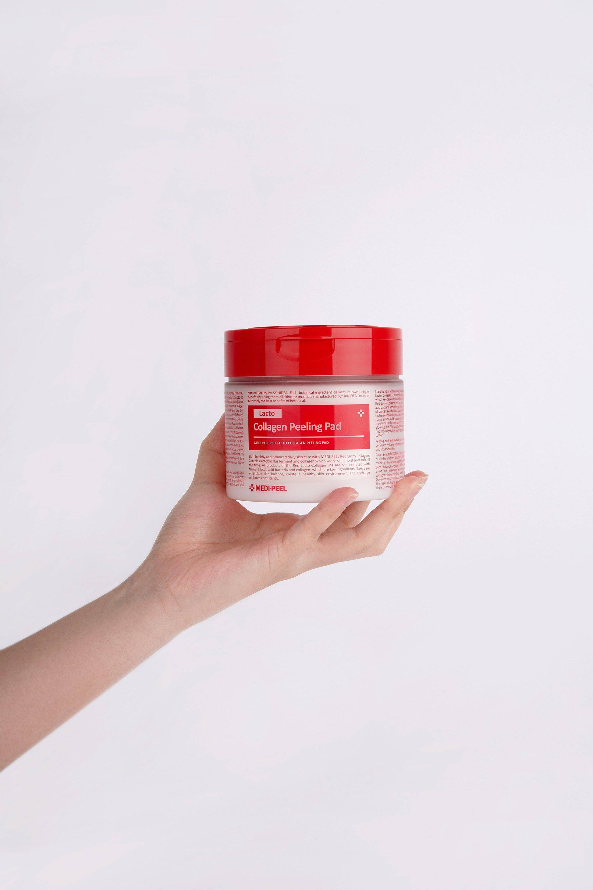 Red Lacto Collagen Peeling Pad from MEDIPEEL+, a toner pad with exfoliating and brightening properties, shown in a close-up image.