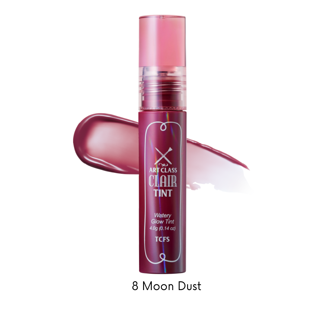 Too Cool For School Artclass Clair Tint lip tint in Moondust shade, featuring a sleek tube and applicator for vibrant, glossy lips.