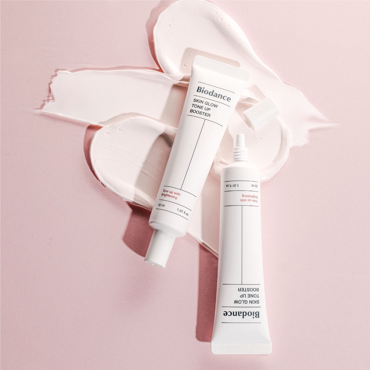 Biodance Skin Glow Tone Up Booster 30ml bottle, brightening tone-up cream with a sleek packaging design.