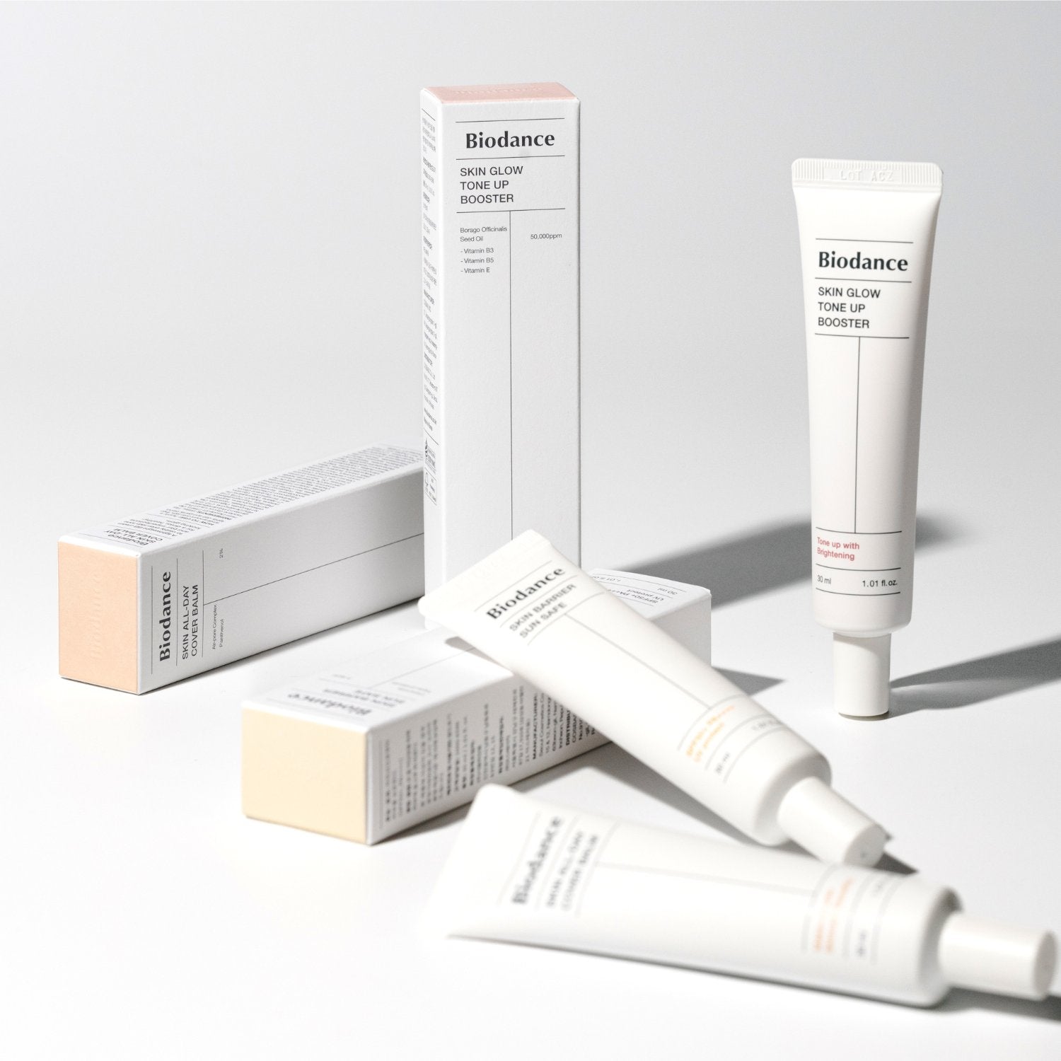 Biodance Skin Glow Tone Up Booster 30ml bottle with white and gold packaging, highlighting the tone-up cream product.