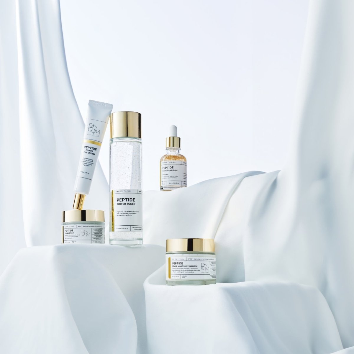 B.O.M Peptide Power Ampoule 30ml in a clear glass bottle with dropper, designed for skincare and anti-aging.