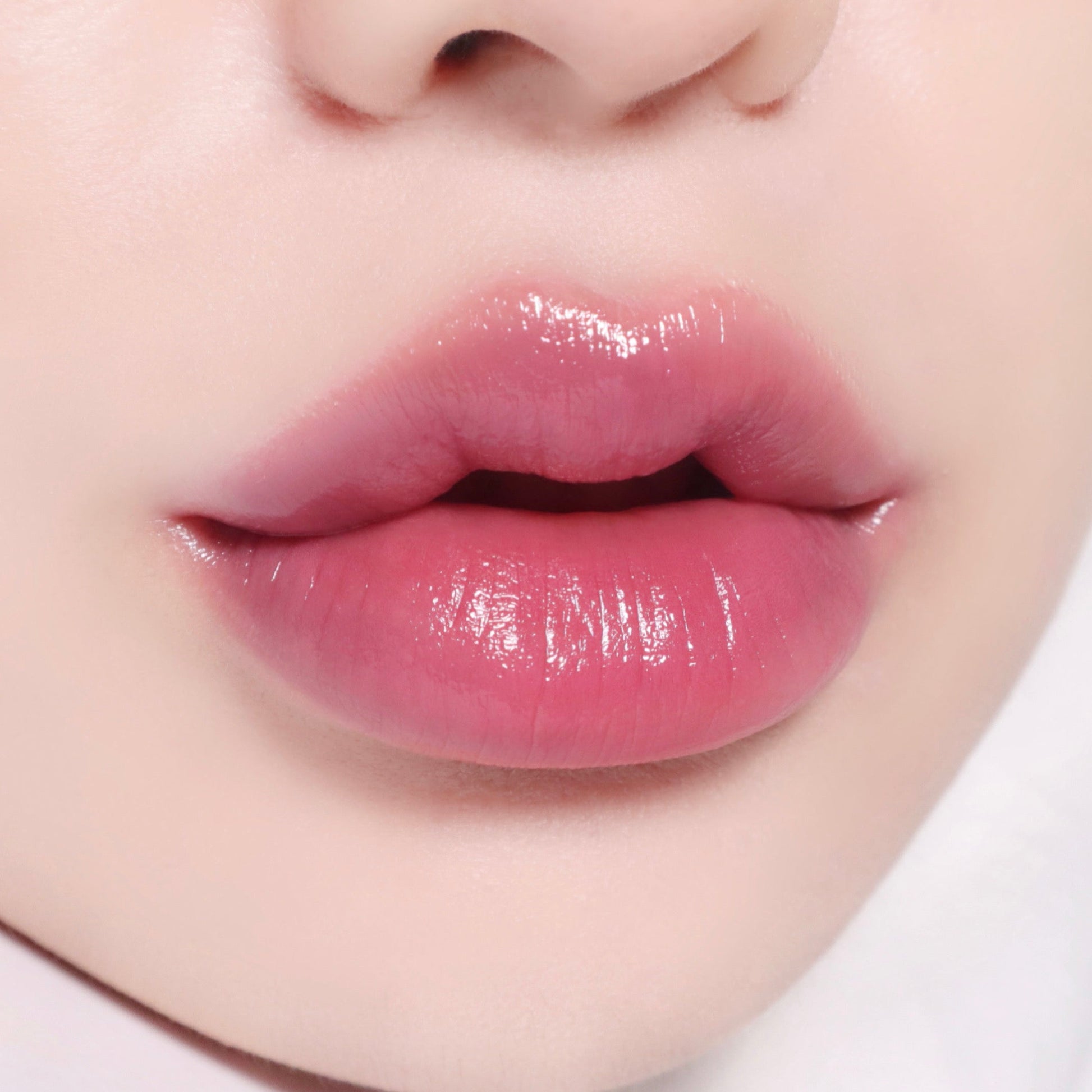Banila Co B. By Banila Glow Veil Lipstick in mauve moon, showcasing the smooth, creamy lipstick with a subtle mauve shade.
