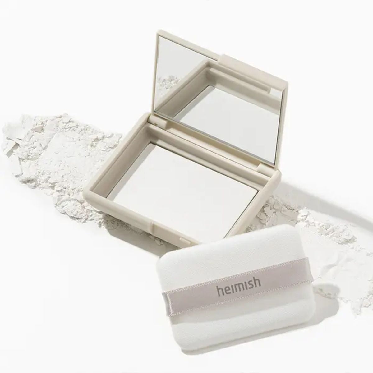 Heimish Moringa Ceramide Pressed Setting Powder in 5g container, close-up of the pressed powder with a smooth, matte finish.