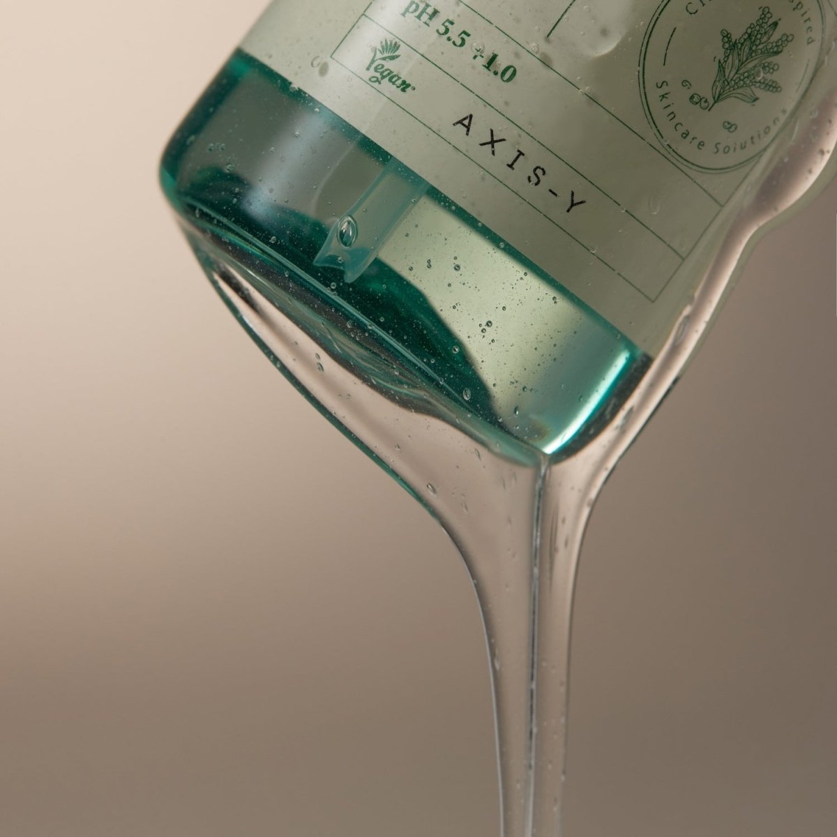AXIS-Y Quinoa One-Step Balanced Gel Cleanser in 180ml bottle, showcasing the clear gel texture designed for gentle facial cleansing.