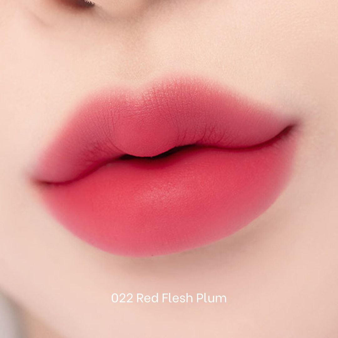 Clio Chiffon Blur Tint in Red Flesh Plum, a vibrant lip tint with a smooth, natural finish, shown on a model's lips.