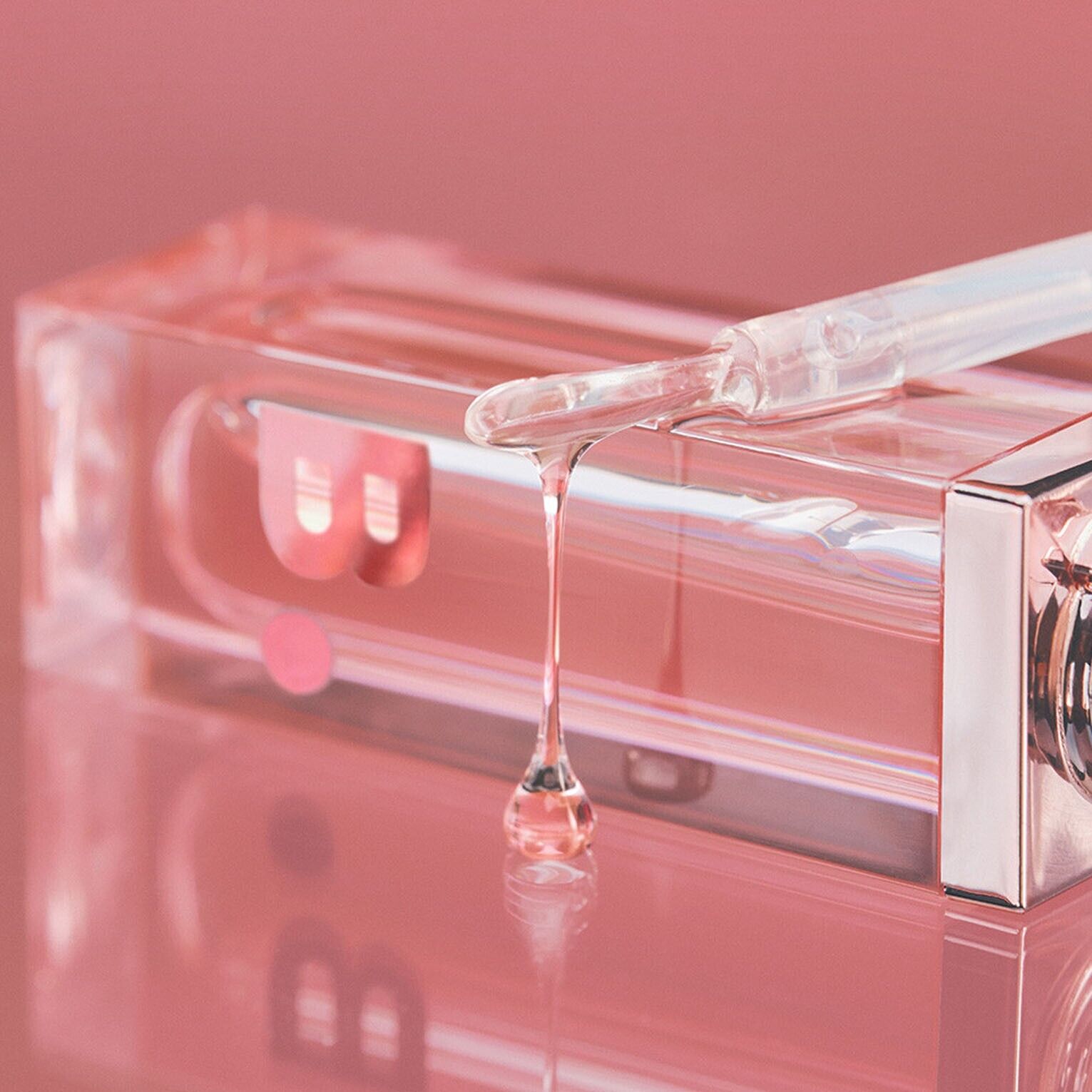 Banila Co B. By Banila Veil Gloss lip gloss with a shiny, smooth finish, displayed in a clear tube showing its glossy texture.