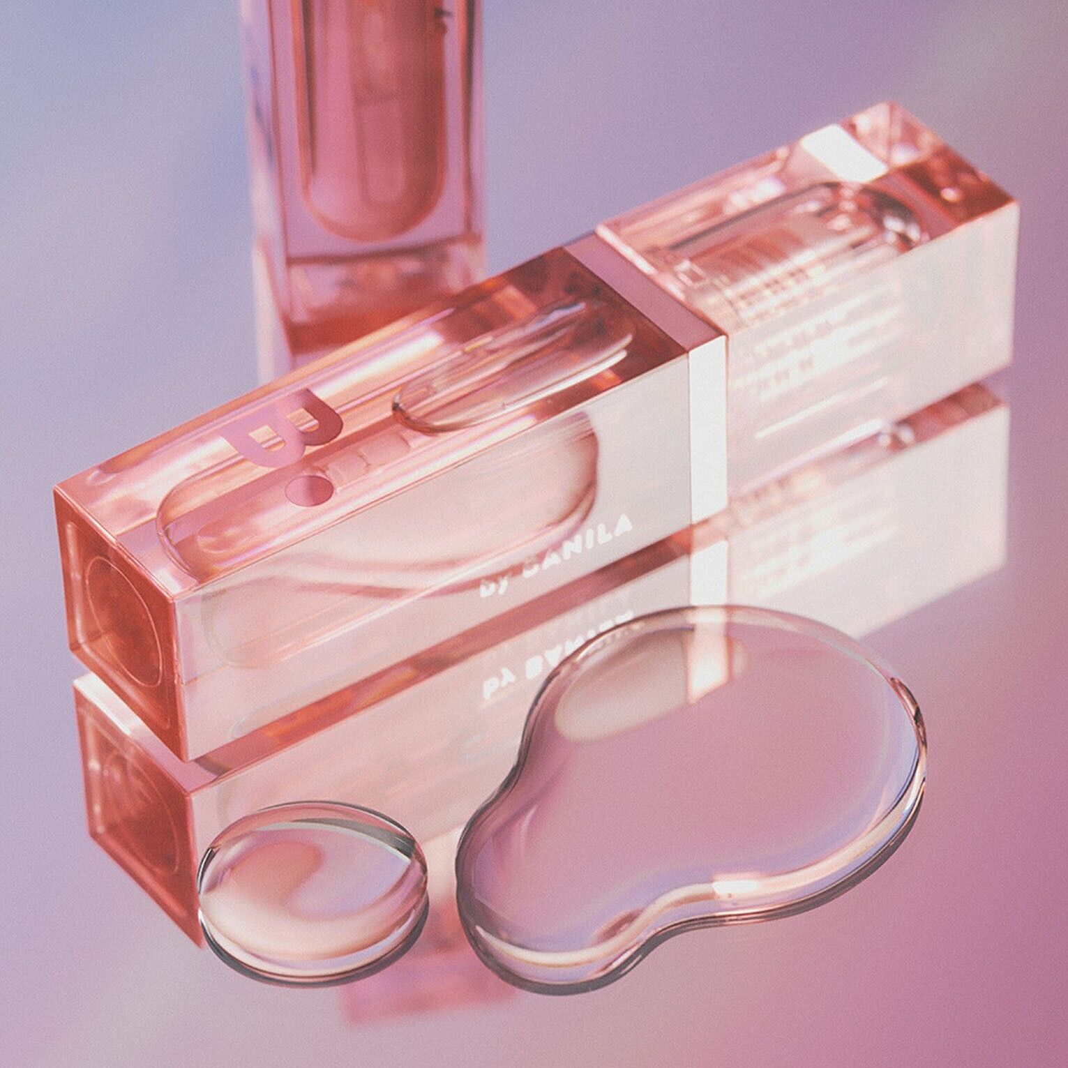 Banila Co B. By Banila Veil Gloss lip gloss with shiny, smooth finish in a clear container showing the gloss inside.