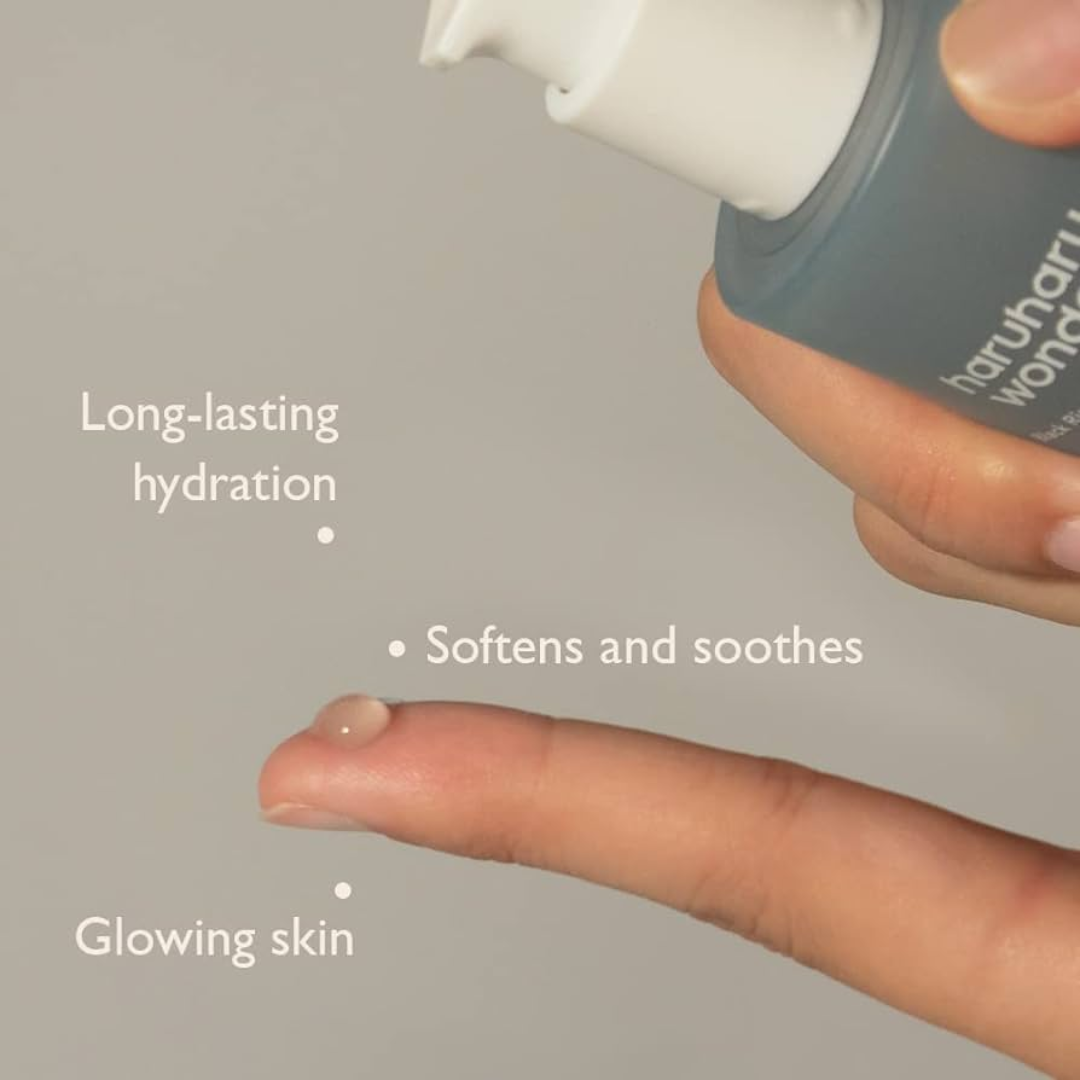 Black Rice Hyaluronic Essence bottle from Haruharu Wonder, featuring a sleek black packaging and clear label.
