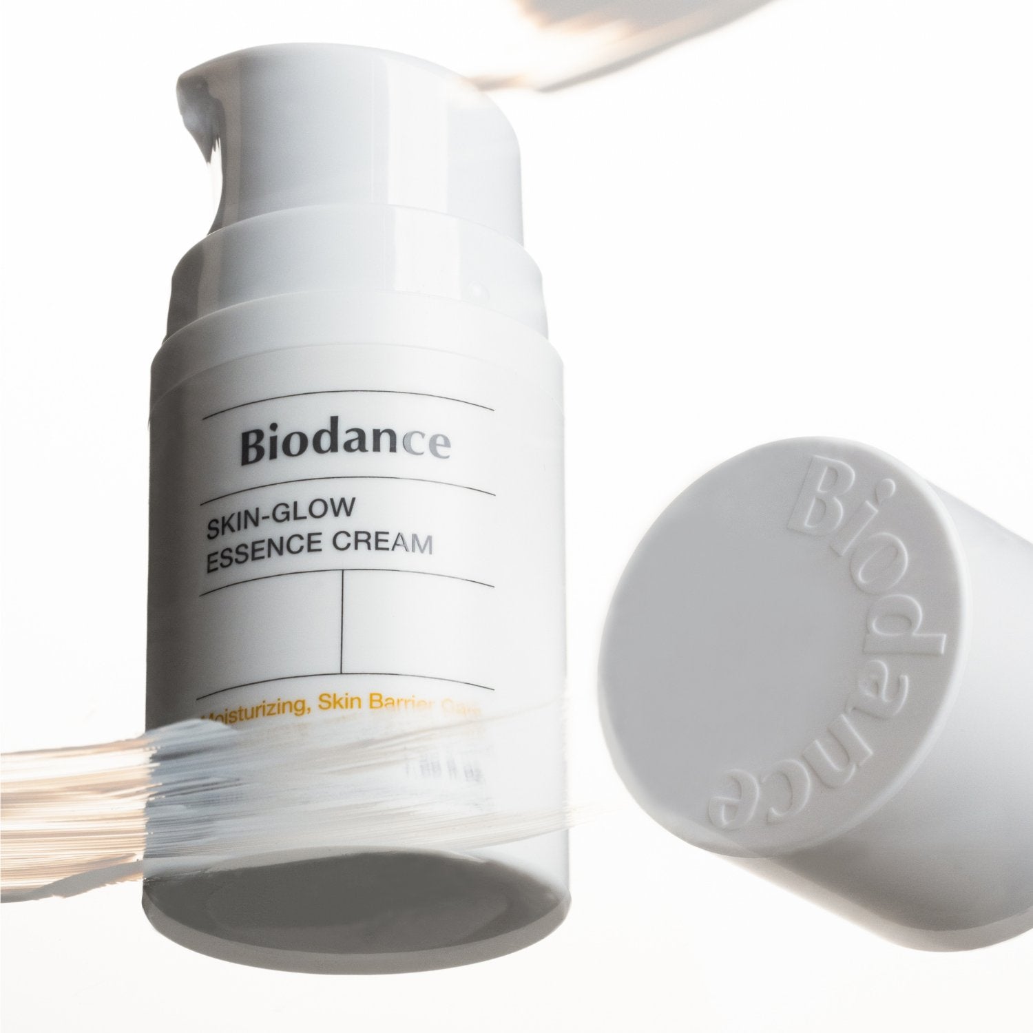 Biodance Skin-Glow Essence Cream 50ml face moisturizer jar with a sleek white and gold design on a white background.