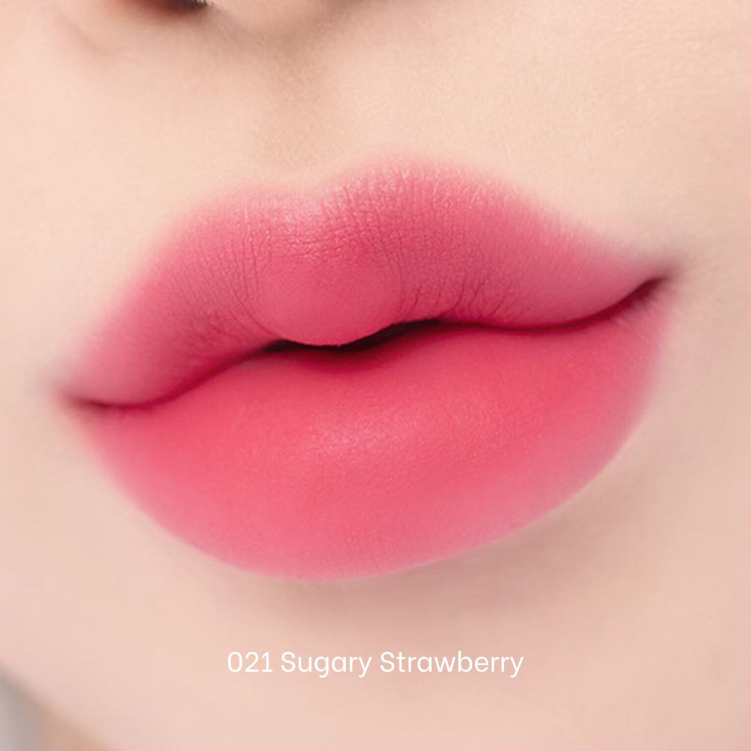 Clio Chiffon Blur Tint lip tint in sugarystrawberry shade, showcasing smooth, fruity-colored lips with a natural finish.