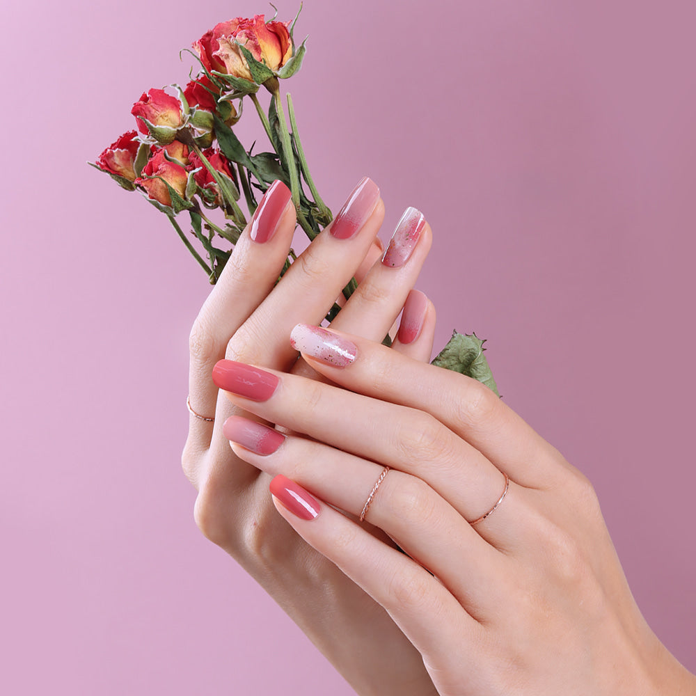 Glossy Blossom Rose Blusher gel nail strips applied on nails with a soft pink and floral design for a stylish manicure.