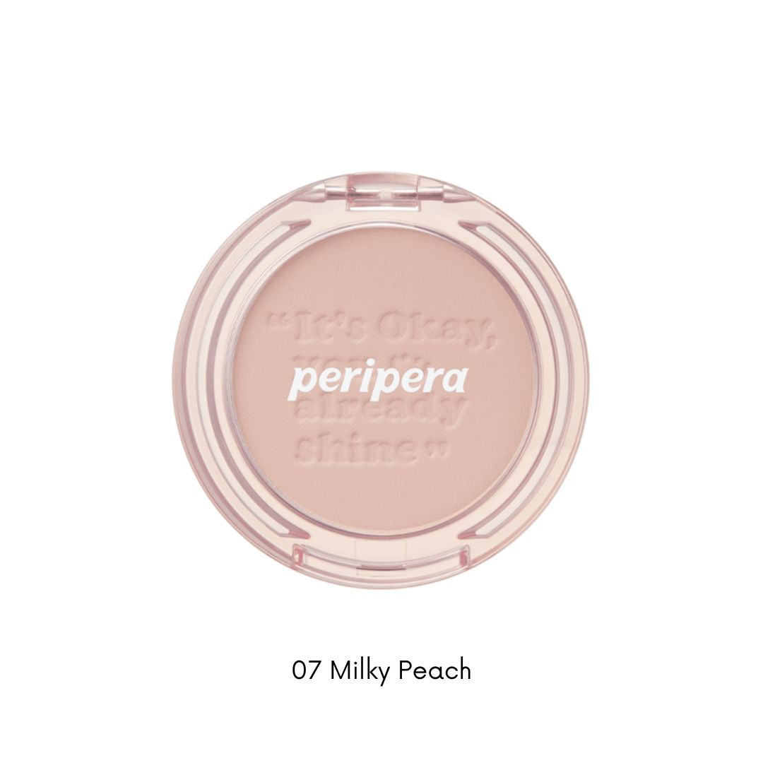Peripera Pure Blushed Sunshine Cheek blush in a soft peach shade, showing a close-up of the powder blush with a smooth texture.