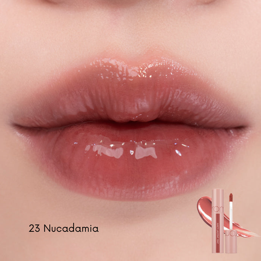 Rom&nd Juicy Lasting Tint lip tint in a vibrant coral shade, displayed on a neutral background with the product bottle and applicator visible.