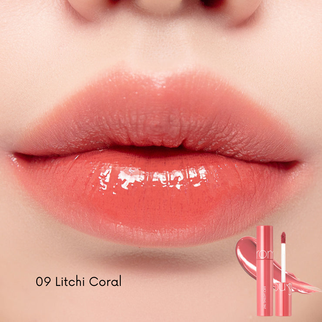 Rom&nd Juicy Lasting Lip Tint in a vibrant pink shade, showing the sleek tube and the tint's rich color on the applicator
