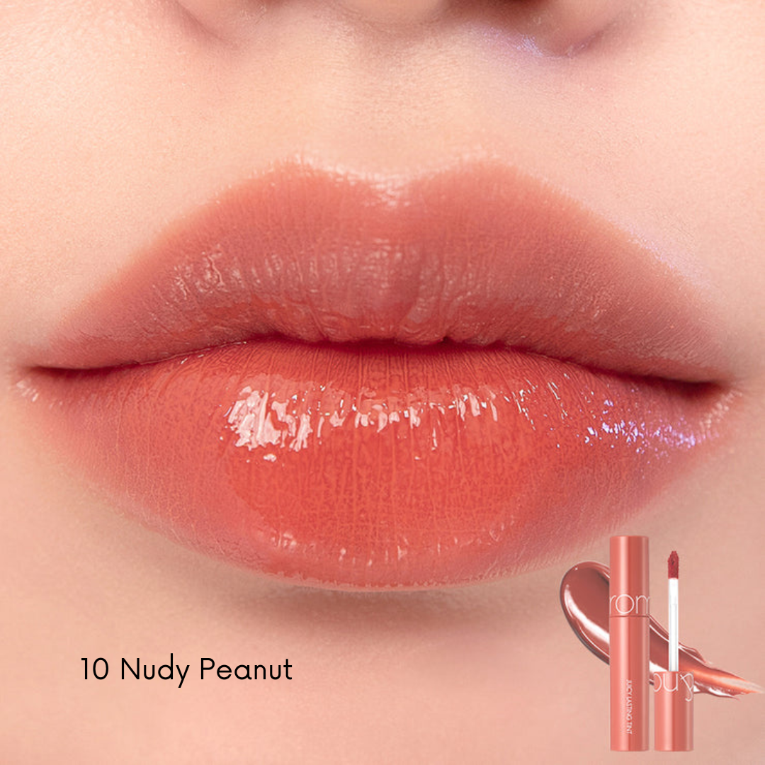 Rom&nd Juicy Lasting Lip Tint in vibrant pink shade, displayed in a sleek tube with the applicator visible.