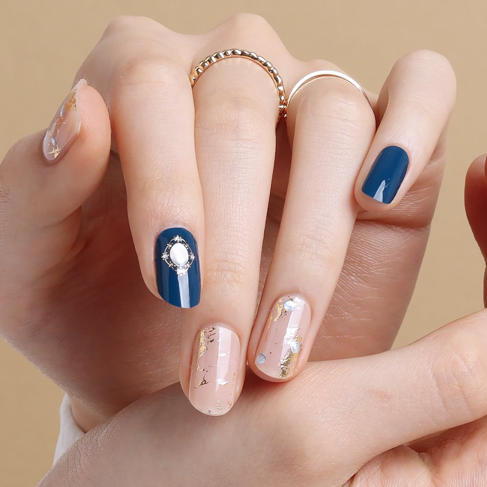 Glossy Blossom Imperial Blue gel nail strips applied on natural nails, showcasing vibrant blue and glossy finish.
