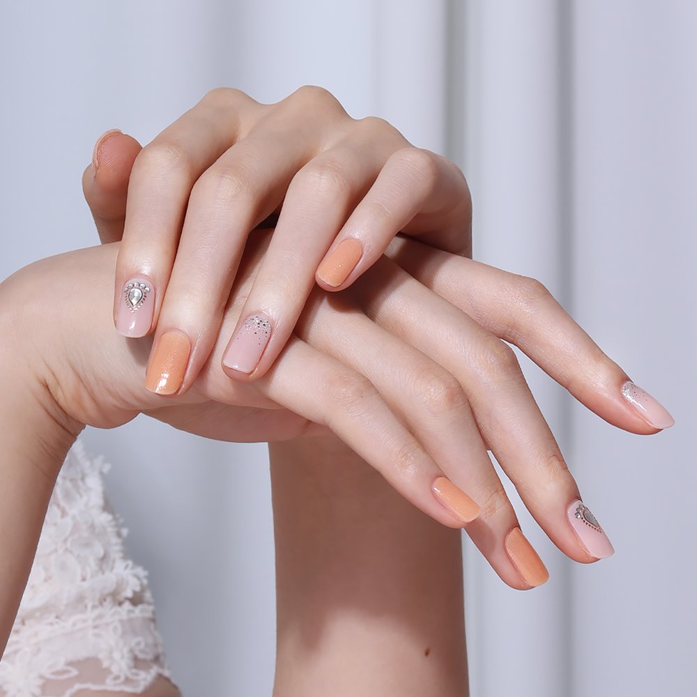 Glossy Blossom Dewdrop gel nail strips on nails, showcasing a vibrant and glossy floral design for easy at-home nail art.