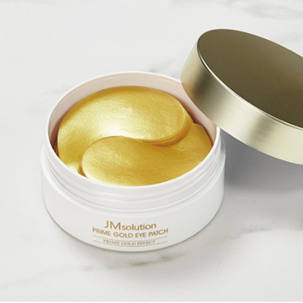 JMsolution Prime Gold Eye Patch pack with 2 sets of 60 gold-colored eye patches for under-eye care and hydration.
