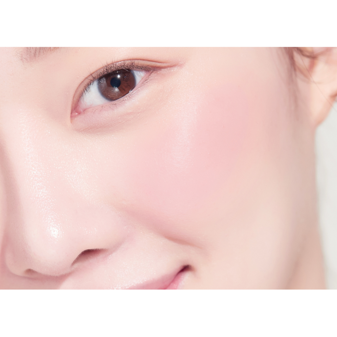 Peripera Pure Blushed Sunshine Cheek blush in a soft pink shade, showing the smooth powder and compact packaging.
