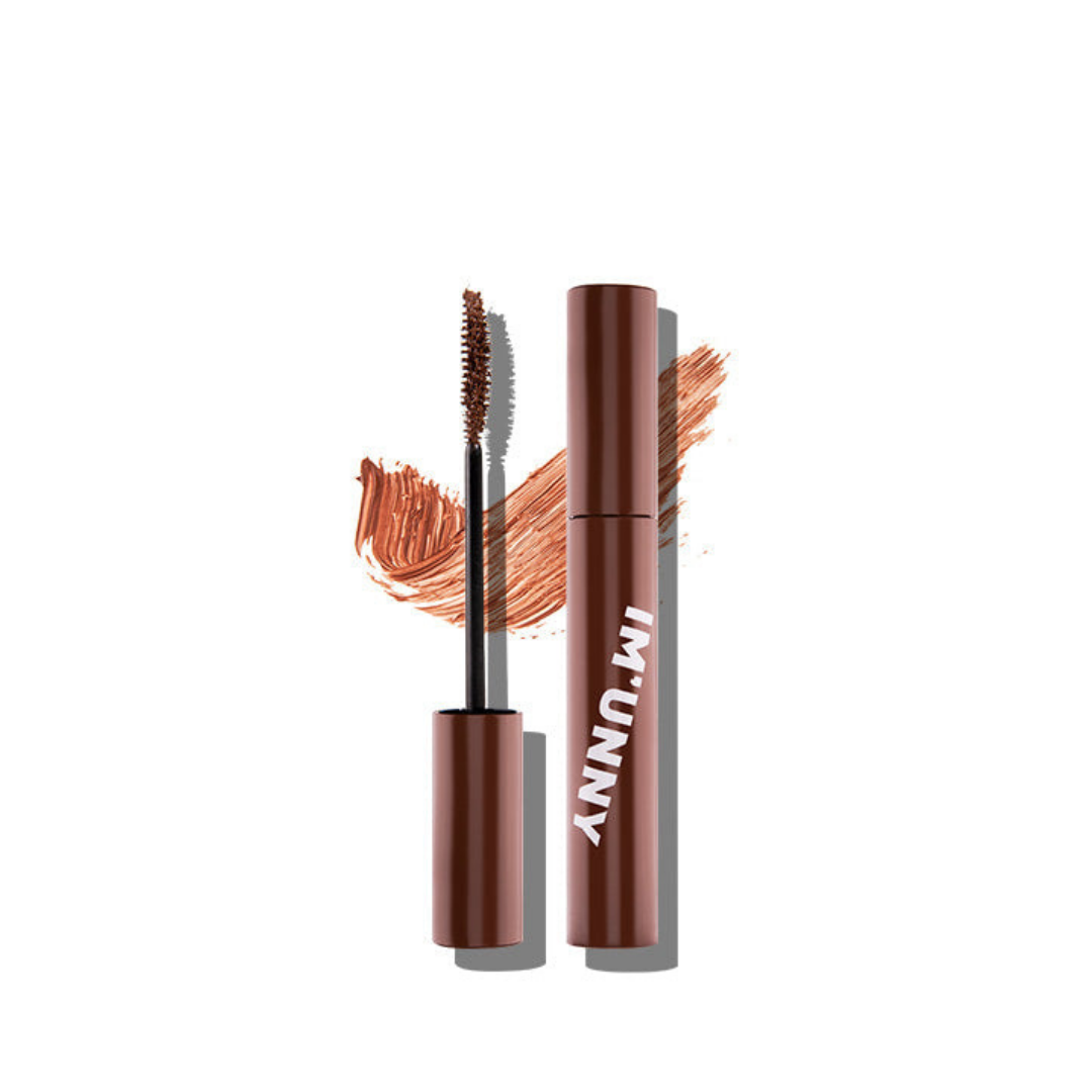 I'M UNNY Lash Extended Perm Mascara wand showing black mascara formula on a brush for voluminous, long-lasting lashes.