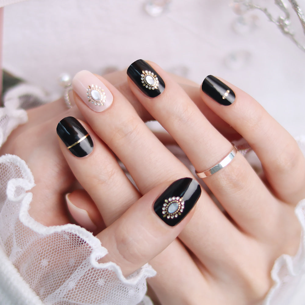 Glossy Blossom Bold Stone gel nail strips on nails with a textured, earthy stone pattern for a stylish manicure.