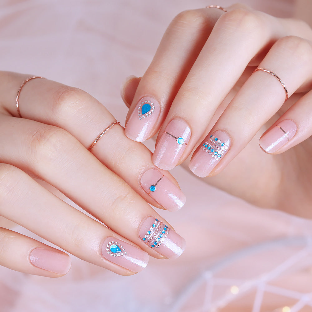 Glossy Blossom Gel Nail Strips in Shining Drop design on nails, showcasing shiny, vibrant, and smooth gel nail strip application.