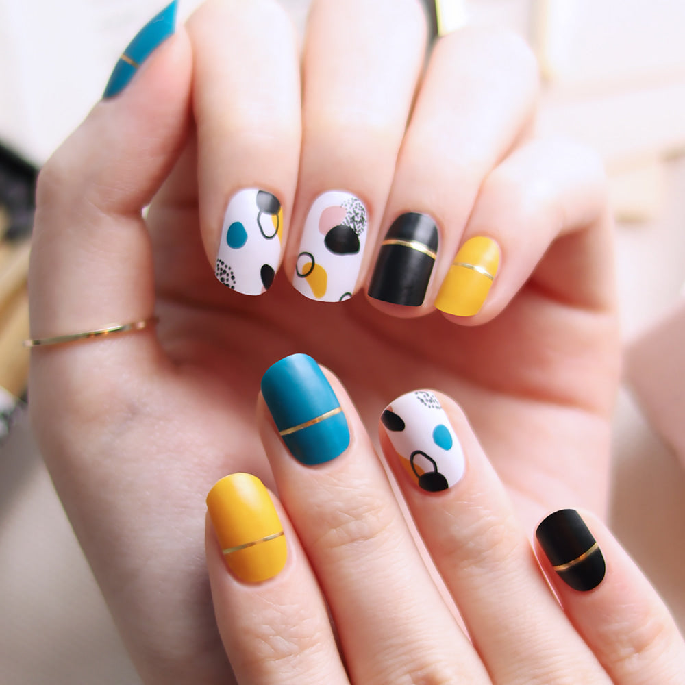 Glossy Blossom gel nail strips with hand-drawn matte floral design on nails, showcasing stylish, artistic nail art.