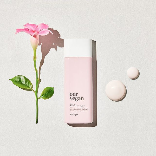Ma:nyo Vegan Sun Fluid Glow SPF50+ PA++++ sunscreen in a 50ml bottle, showing the sleek, sun-protective packaging.