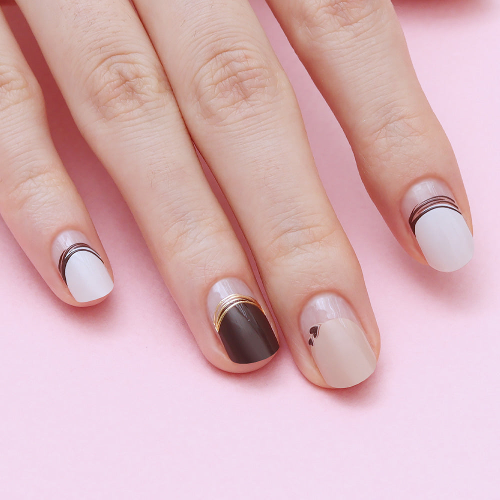 Glossy Blossom Gel Nail Strips in Sweet Filled Latte with a creamy, latte-inspired nail design on neatly shaped nails.