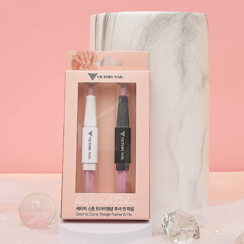 Victory Nail ceramic triangle pusher and file for nails, featuring a smooth ceramic surface and ergonomic design.