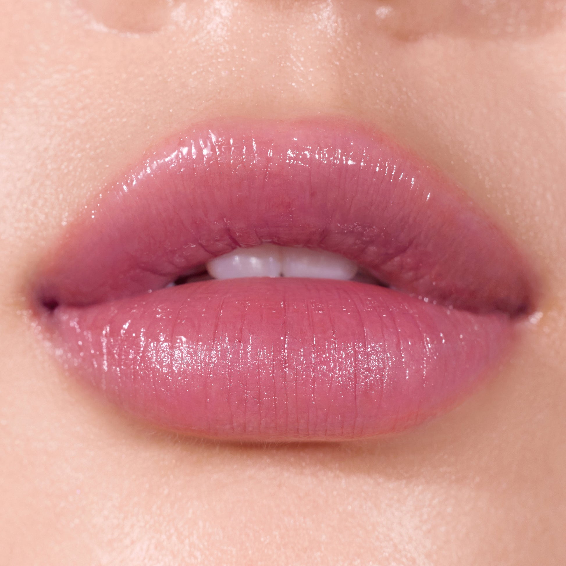 Peripera Ink Mood Glowy Balm lipstick swatch showing vibrant, glossy lip color in a close-up image.
